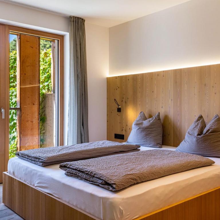 Vista Dolomites Apartment Energy - Appartamento Deluxe con 2 Camere da Letto e Vista Giardino - 17