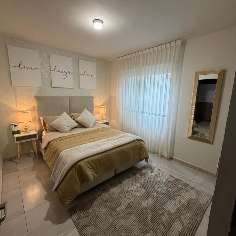 Depa equipado planta baja, alberca, gym y excelente ubicación, a 10min de estadio BBVA sede del mundial - Two-Bedroom Apartment - 19
