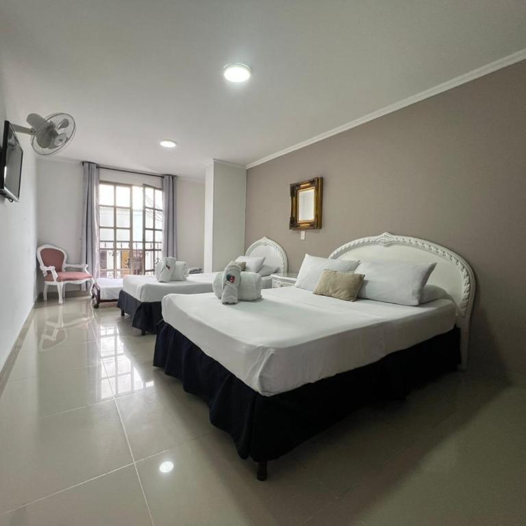 Hotel Suite Santa Rosa - Habitación Cuádruple Estándar - 10