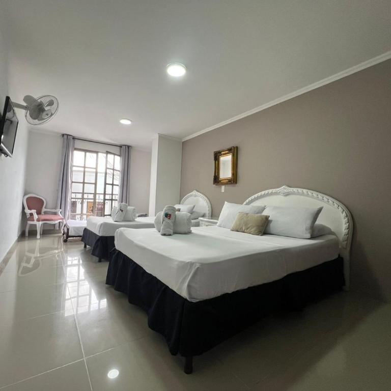 Hotel Suite Santa Rosa - Habitación Cuádruple Estándar - 12