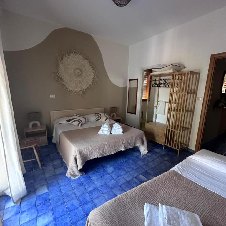 Nido Colorato B&B - Camera Tripla Deluxe con Vista Mare - 1