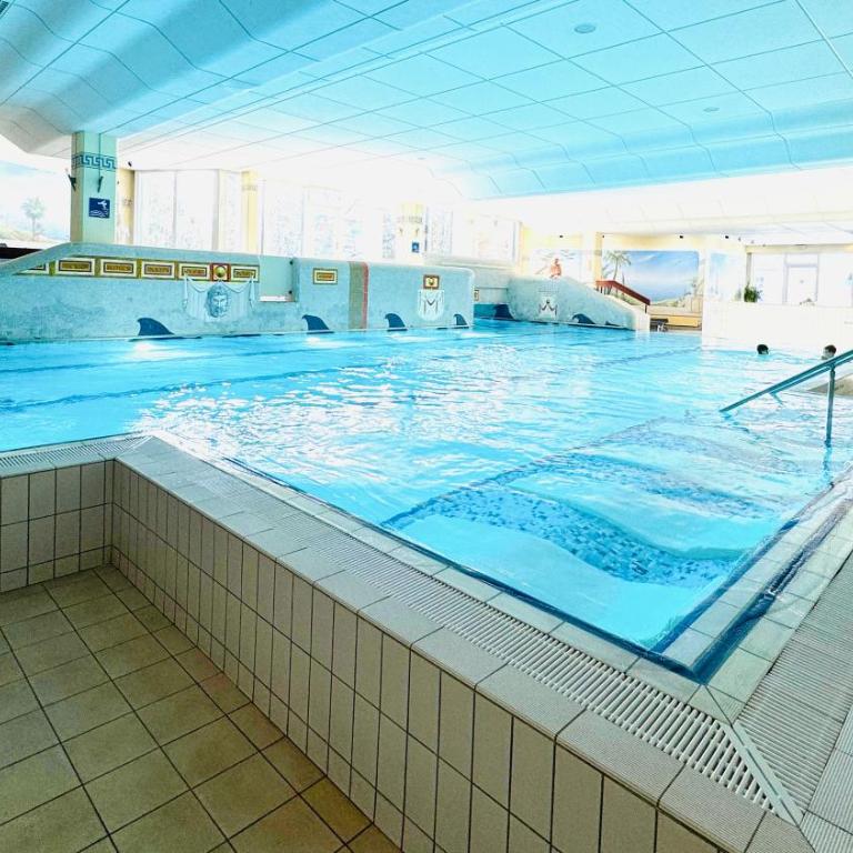 Ferienwohnung Harmonia inklusive Hallenbad, Außenpool, Sauna & Fitnessstudio, familienfreundlich ausgestattet, großes 2-Zimmer-Apartment - Apartment mit 2 Schlafzimmern - 21