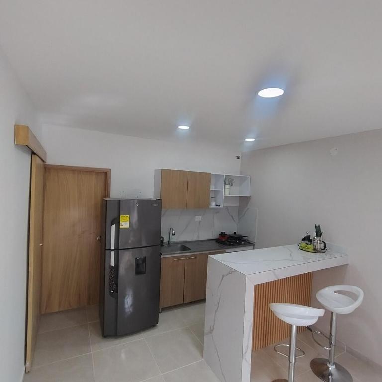 Suite moderna con parqueadero y cocina equipada - Apartamento de 1 dormitorio - 13