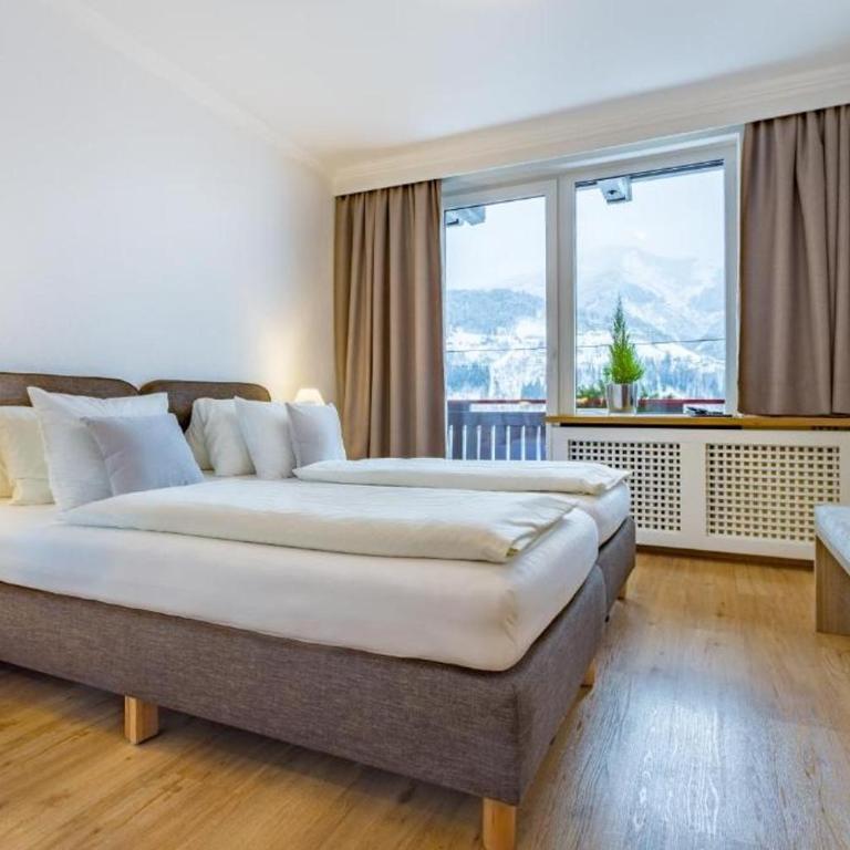 Ski-n-Lake City Apartments - Doppelzimmer mit Seeblick - 14