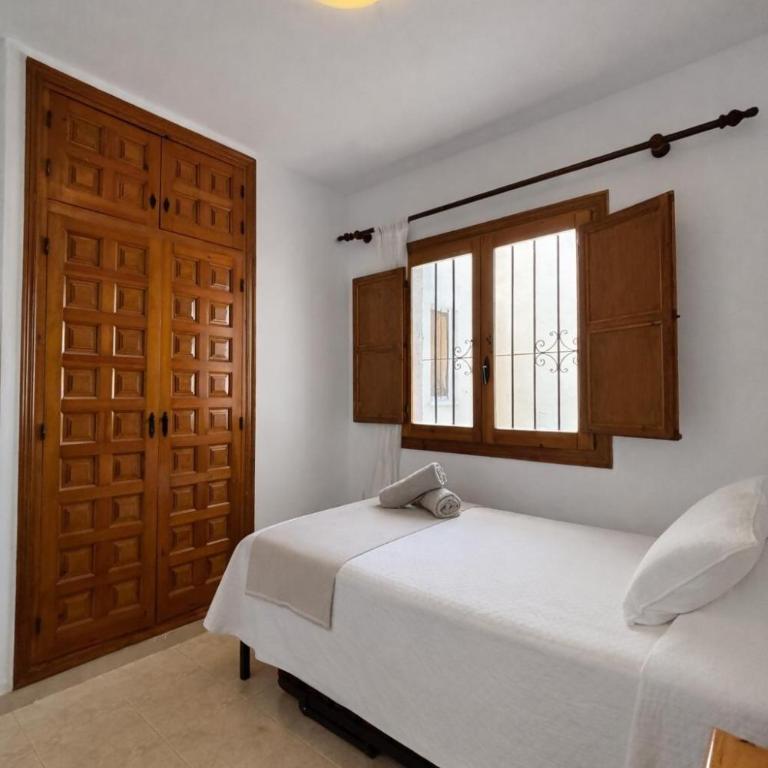 Apartamento con jardín, piscina y parking - Apartamento de 2 dormitorios - 44