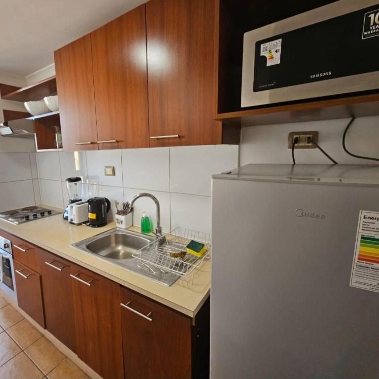departamentos amoblados AVILA bulnes la moneda - Quadruple Room with Balcony - 3