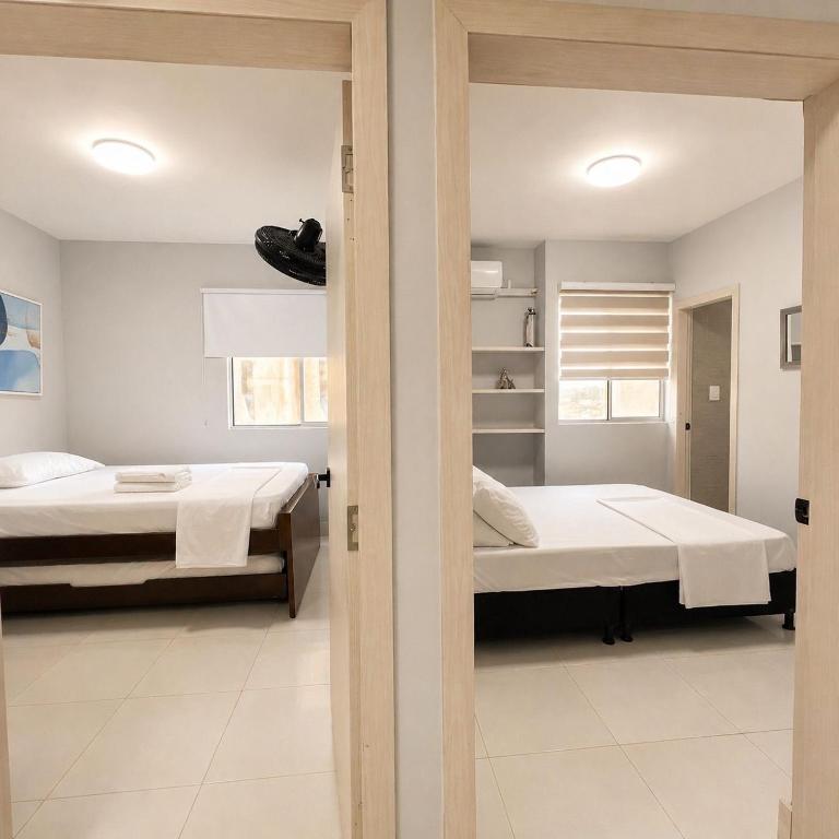 Prime vista al mar con piscina piso alto - Three-Bedroom Apartment - 22