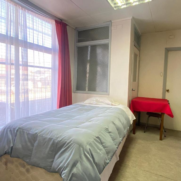 Hostal Cochrane - Quadruple Room with Private Bathroom - 1