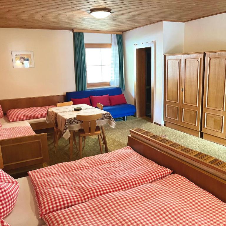 Gästehaus Reiter - Vierbettzimmer mit Seeblick - 1