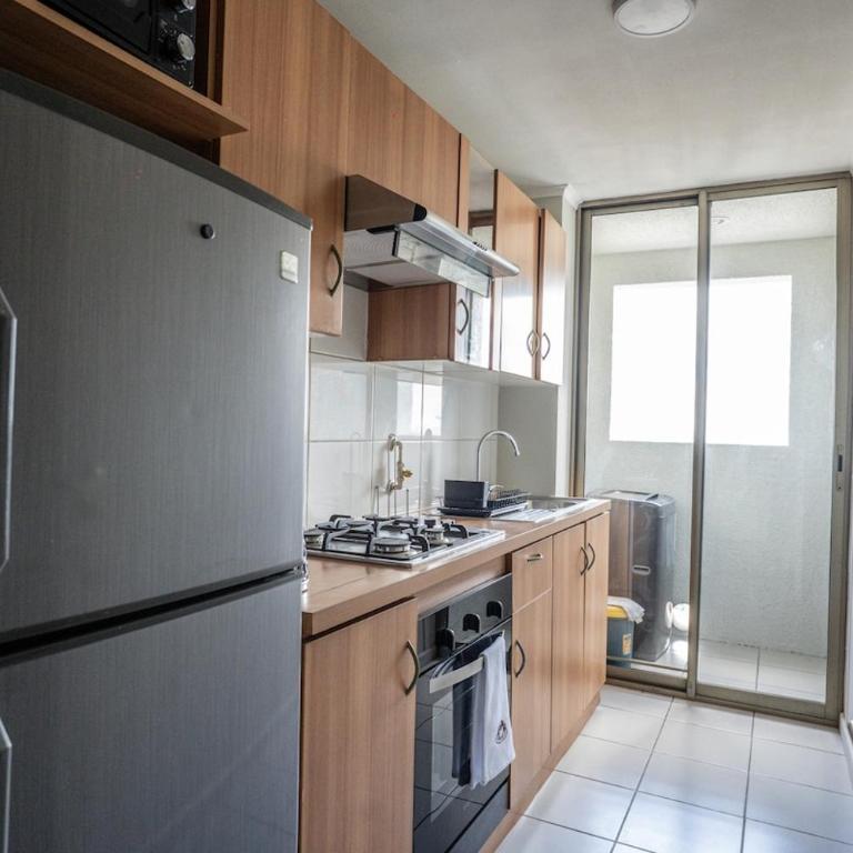 Moderno departamento en centro Talca - Estacionamiento y WiFi - Two-Bedroom Apartment with City View - 13