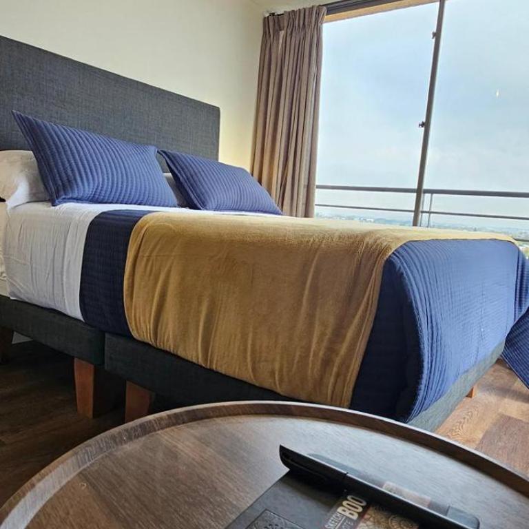 Moderno departamento en centro Talca - Estacionamiento y WiFi - Two-Bedroom Apartment with City View - 11