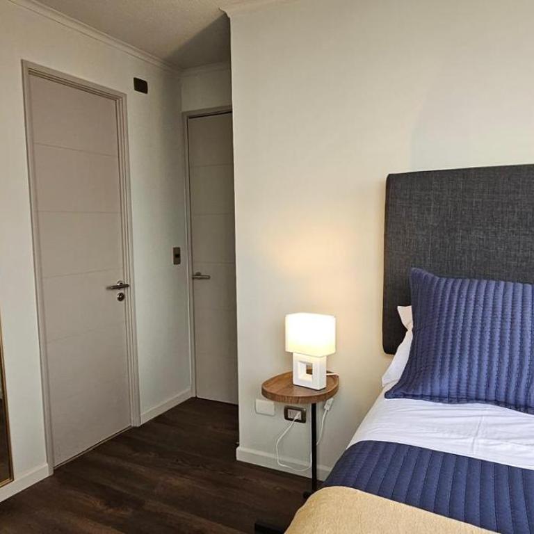 Moderno departamento en centro Talca - Estacionamiento y WiFi - Two-Bedroom Apartment with City View - 17
