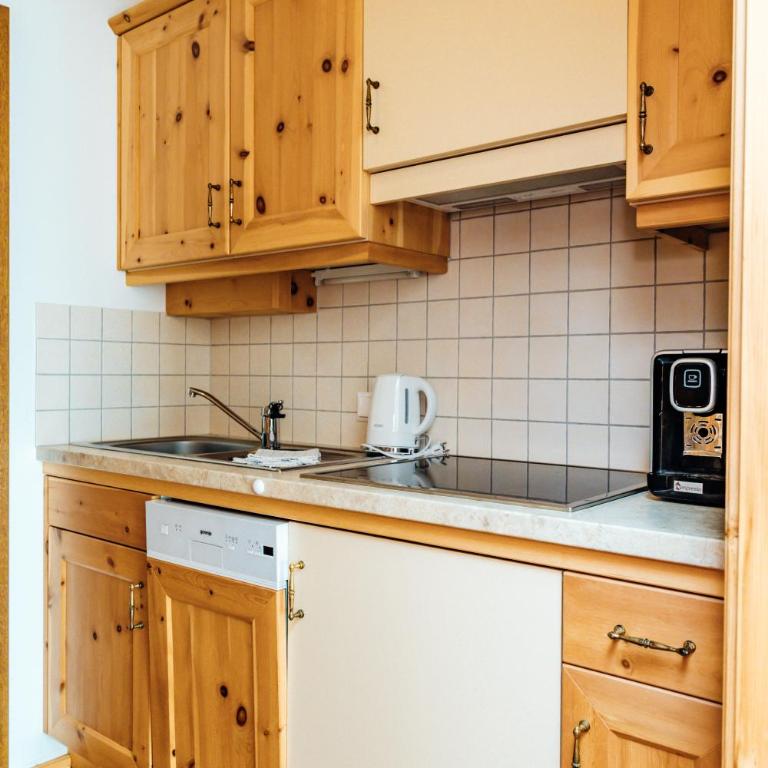 Appartments Bergland an der Brunnachbahn - Deluxe Apartment mit 1 Schlafzimmer und Gartenblick - 14