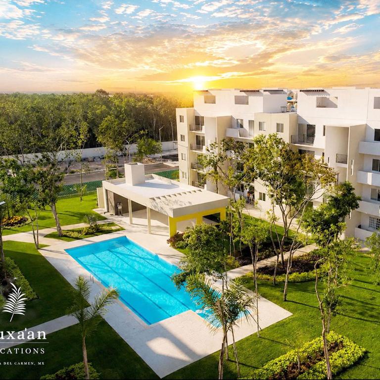 Kuxaan Cielo Terraza privada y comodidad a pocos minutos de la playa - Three-Bedroom Apartment - 1