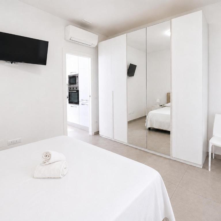 Hostdomus - Fior di mare - alloggi con parcheggio privato - Appartamento con 1 Camera da Letto - 1