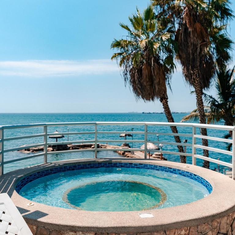 Departamento con vista al mar, piscina, jacuzzi y área BBQ - Apartment - 45