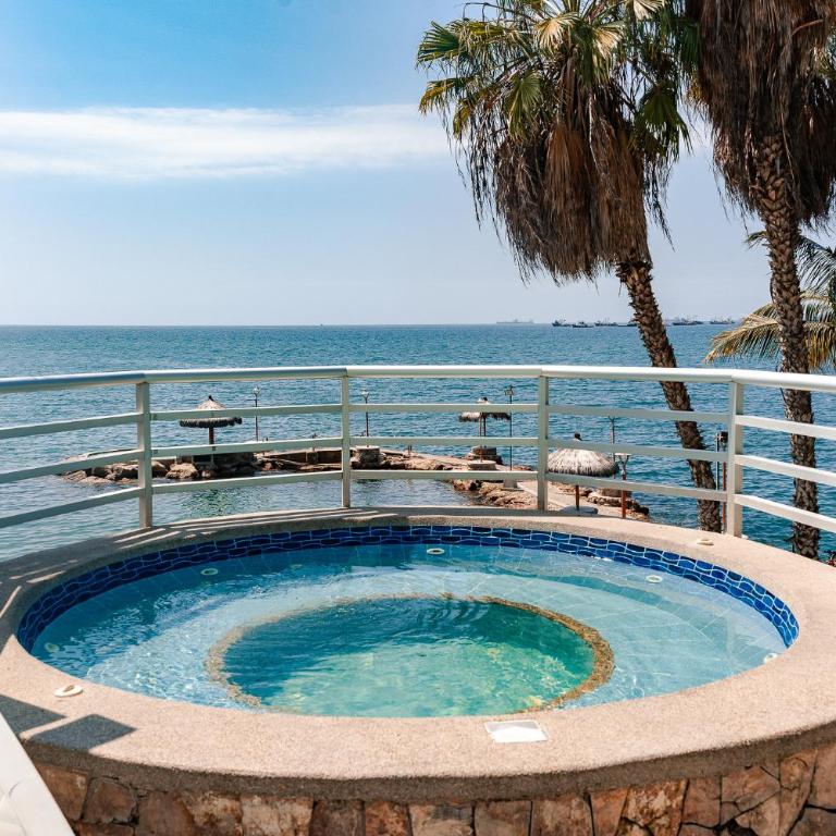 Departamento con vista al mar, piscina, jacuzzi y área BBQ - Apartment - 53