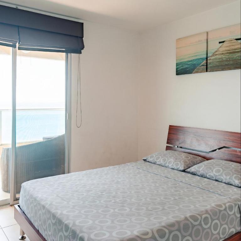 Departamento con vista al mar, piscina, jacuzzi y área BBQ - Apartment - 76