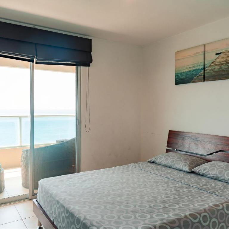 Departamento con vista al mar, piscina, jacuzzi y área BBQ - Apartment - 77