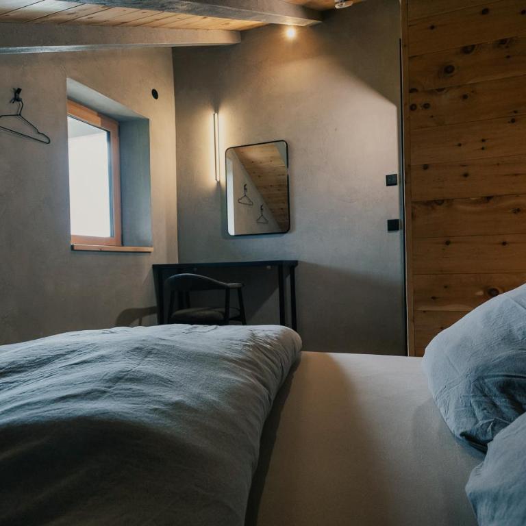 Luxus Suite mit Zirbensauna, Alpenblick und Pool - Deluxe-Apartment mit 2 Schlafzimmern und Gartenblick - 14