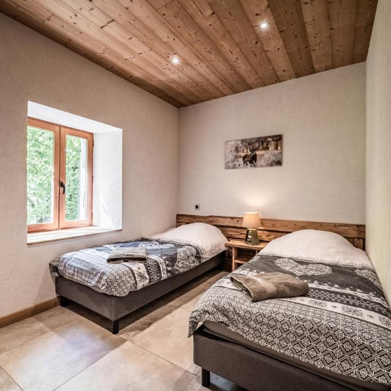 Appartement Cosy ambiance montagne - Two-Bedroom Deluxe Apartment with Garden View - 13