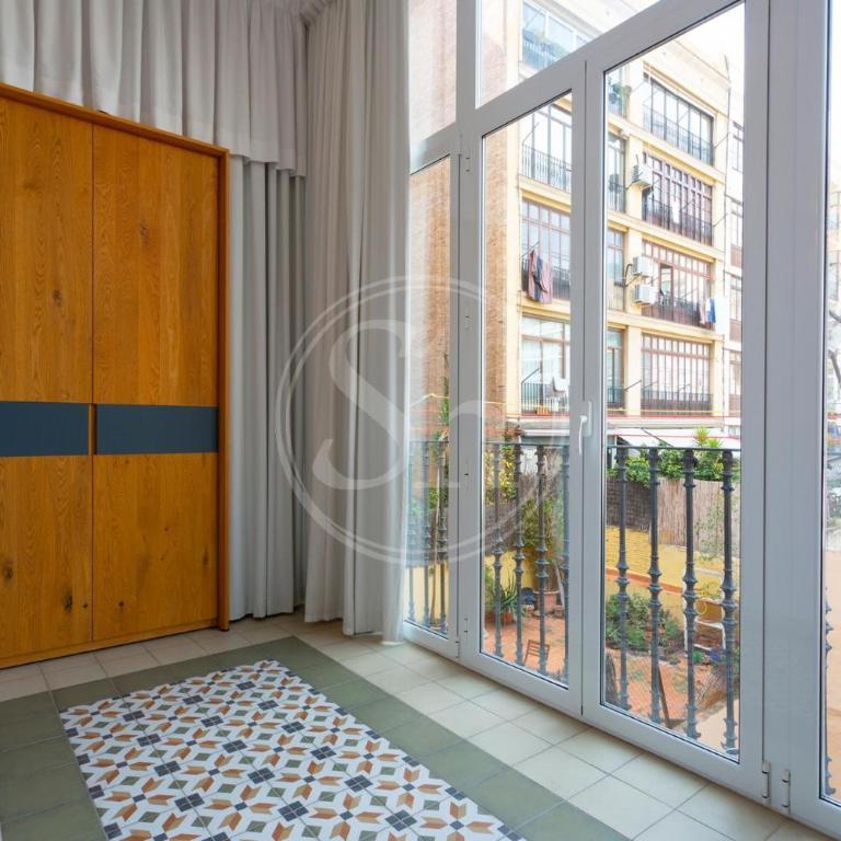 Moderno y espacioso apartamento en Calle Mallorca - Three-Bedroom Apartment - 25