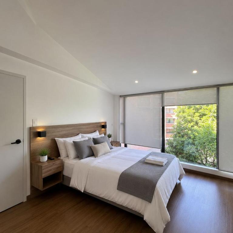Departamentos Cuenca Luxury - Suite con vistas al jardín - 3