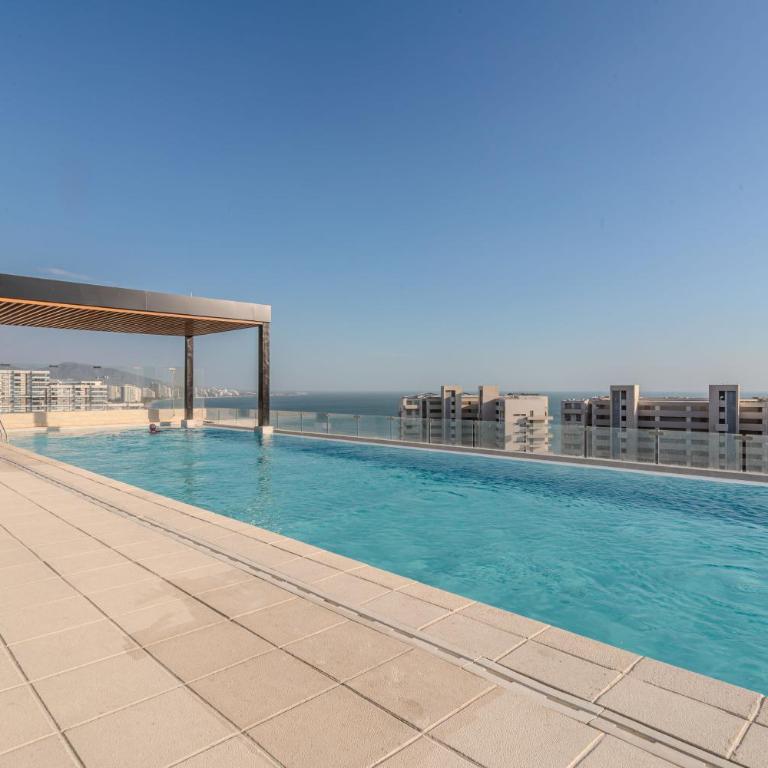 Exclusiva suite moderna con balcón cerca al mar - One-Bedroom Apartment - 40