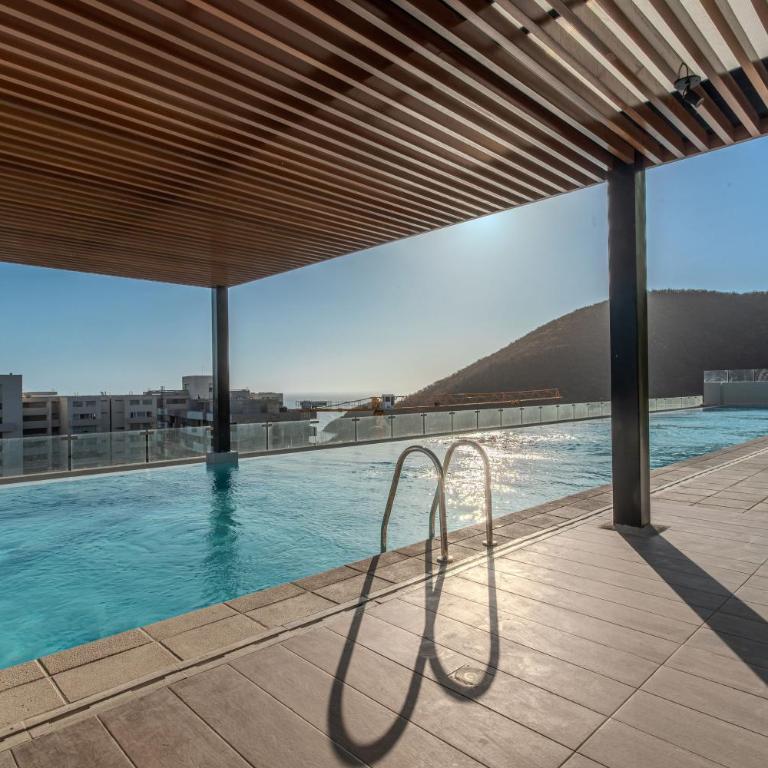 Amplia Suite Moderna con balcón cerca al mar - One-Bedroom Apartment - 9