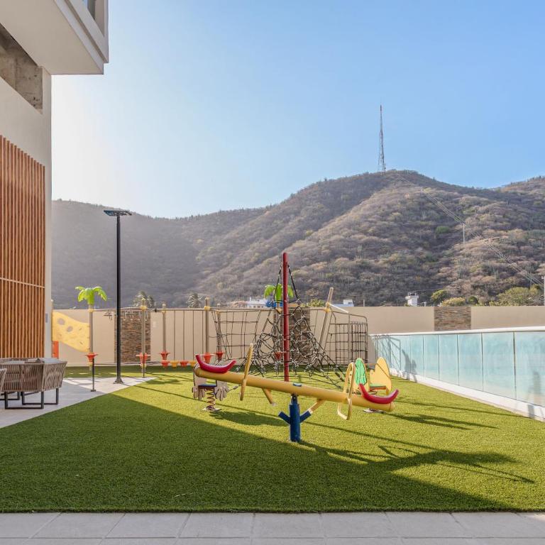 Amplia Suite Moderna con balcón cerca al mar - One-Bedroom Apartment - 28