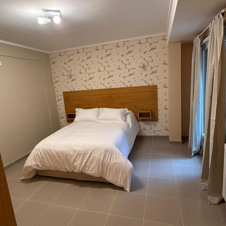 Apart Hotel Ostrón - Habitación Cuádruple - vistas al jardín - 9