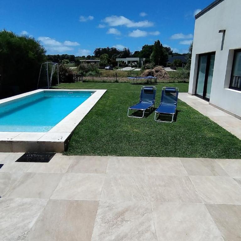 Arenas del Sur pileta climatizada una planta - Three-Bedroom House - 1