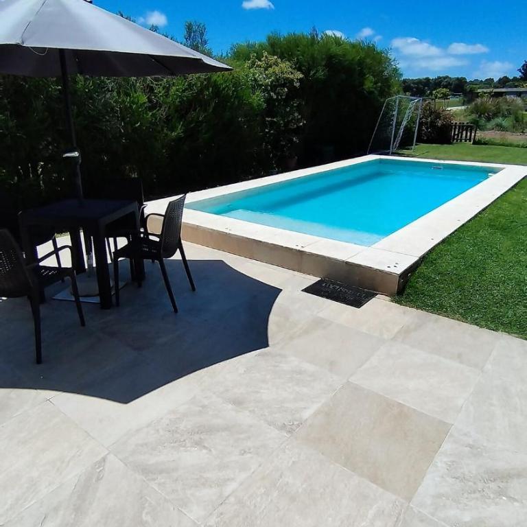 Arenas del Sur pileta climatizada una planta - Three-Bedroom House - 3