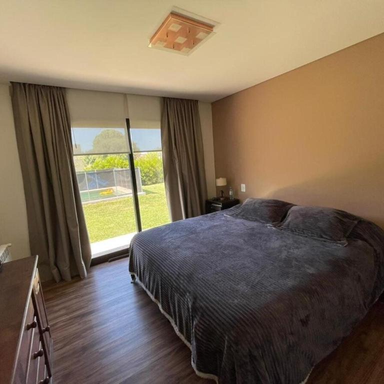 Arenas del Sur pileta climatizada una planta - Three-Bedroom House - 12