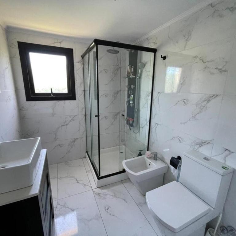 Arenas del Sur pileta climatizada una planta - Three-Bedroom House - 26