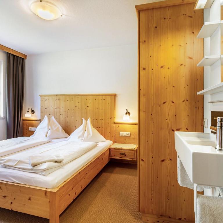 Appartements Stockinger A1 - Appartamento Deluxe con 2 Camere da Letto e Vista Giardino - 11