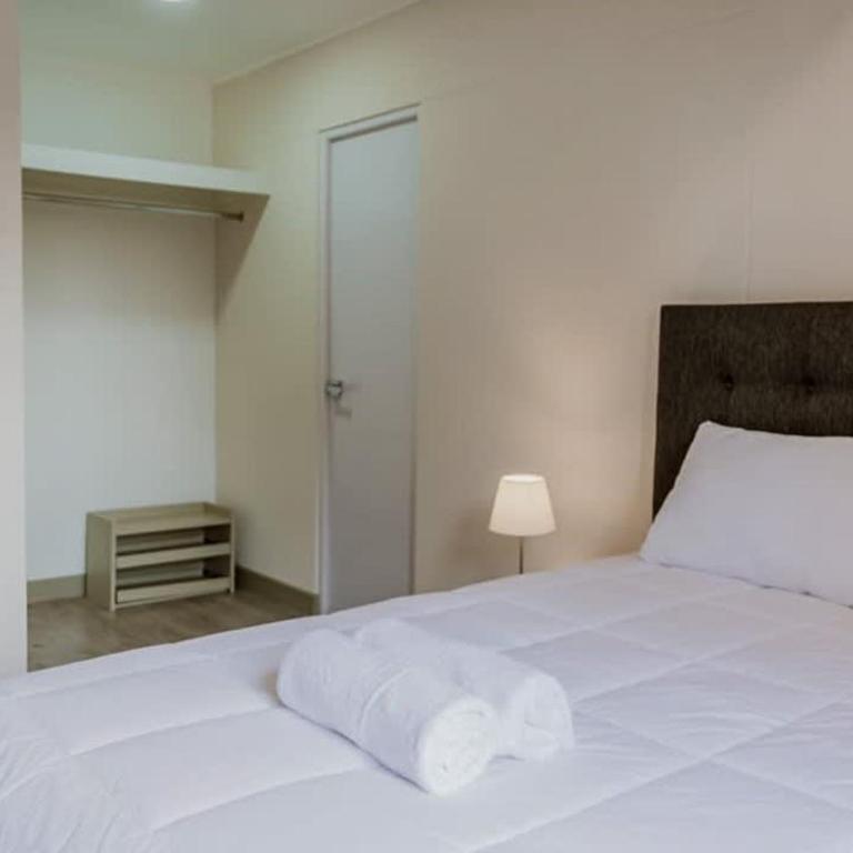 Stylish 2BR Retreat with Pool, Gym & Great Location - Apartment - 12