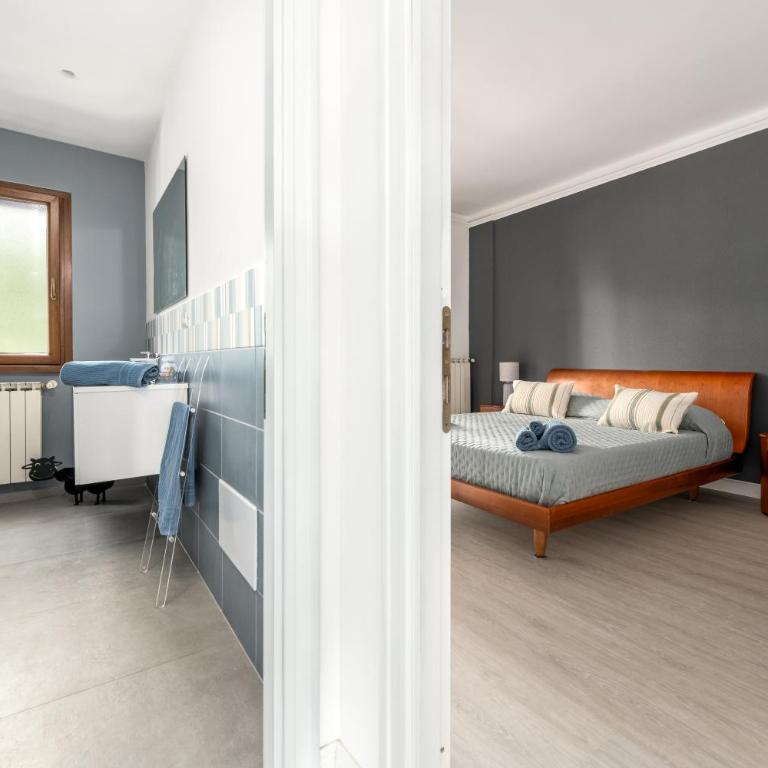 La Casa del Tomo - Metro A - Parcheggio Privato - 6 ospiti - Appartamento con 2 Camere da Letto - 72