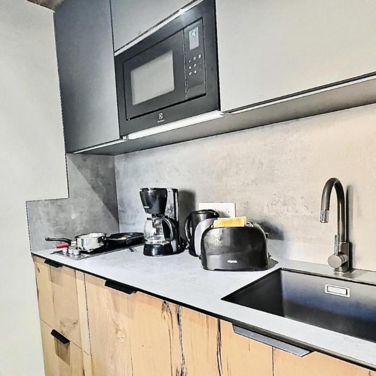 Résidence Le Rosset - Studio 4 personnes à Tignes proche des commerces, des pistes et de l'agence CIS dans le quartier du Rosset.Grand studio de 28m², MAE-2111 - Studio - 4