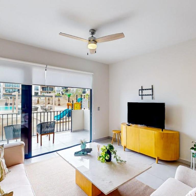 Gorgeous dog-friendly apartment with balcony, open layout, heated pool, & AC - Vacation Home - 1