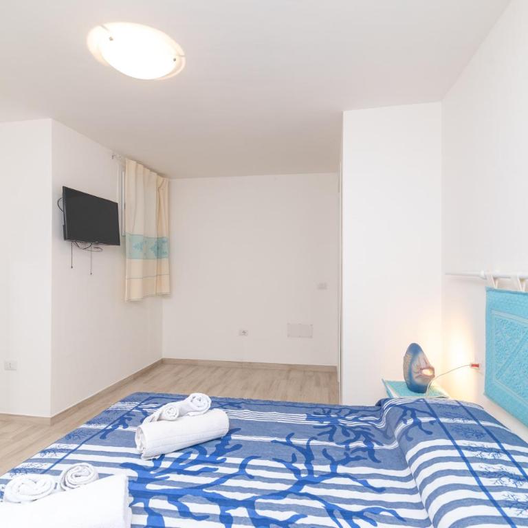 Bilocale nuovo Budoni centro - Appartamento con 1 Camera da Letto e Vista Giardino - 11