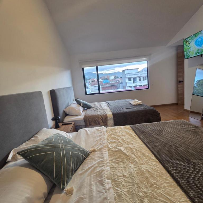 Suite Dúplex Tipo Loft, 6 minutos Parque Calderon56 - One-Bedroom Apartment - 1