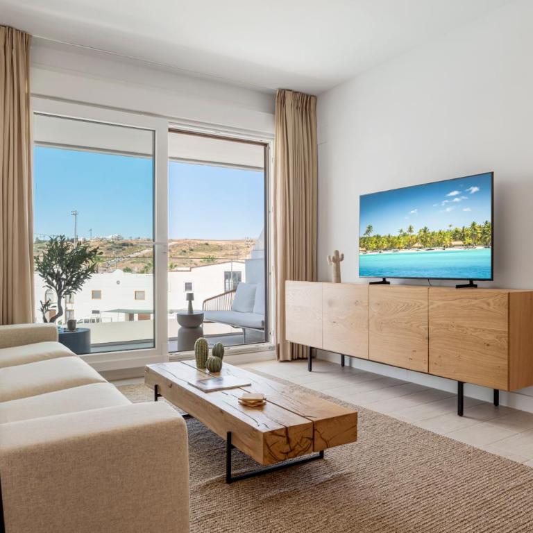 Stylish Poolview City Apartment - Three-Bedroom Apartment with Balcony - 1