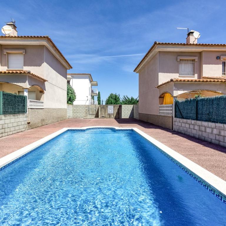 Casa con piscina comunitaria - Maison de Vacances - 1