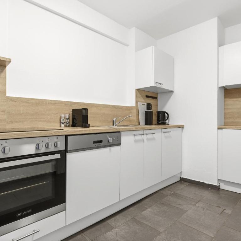Alpena Homes, Zentrum, sehr geräumig, Küche - Apartment mit 2 Schlafzimmern - 3