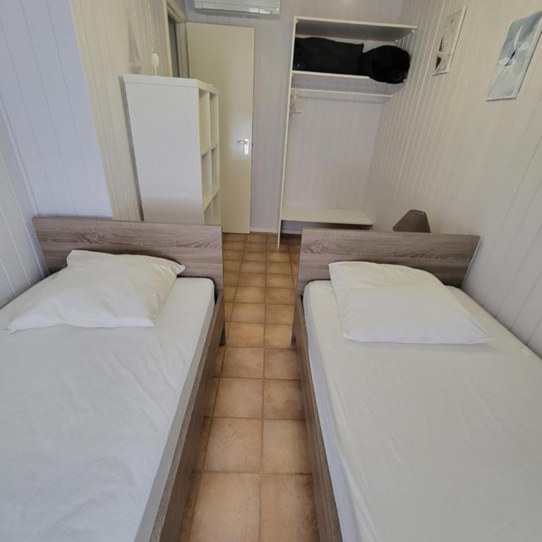 Belle villa de vacances climatisée, residence TAMARIS, wifi, 2 chambres 4 à 6 couchages, accès payant pour les piscines et animations , PORTIRAGNES PLAGE LRTAMA57 - Maison 2 Chambres - 11