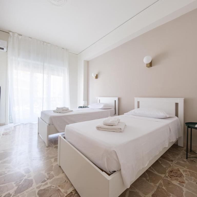 Casa Vacanze Piazza Europa - Appartamento Premium con 3 Camere da Letto e Balcone - 11