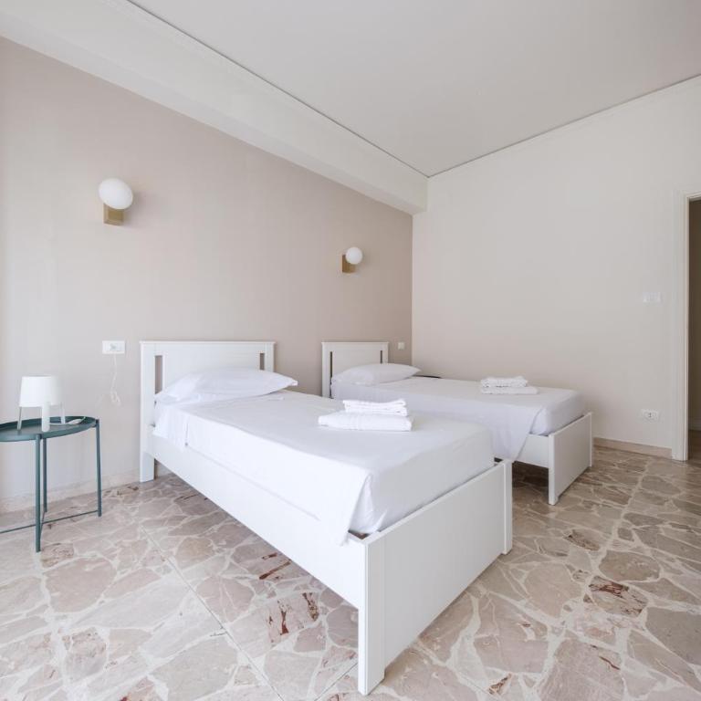 Casa Vacanze Piazza Europa - Appartamento Premium con 3 Camere da Letto e Balcone - 12
