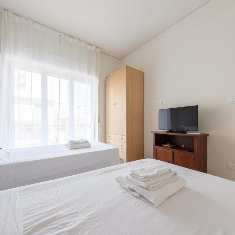 Casa Vacanze Piazza Europa - Appartamento Premium con 3 Camere da Letto e Balcone - 17
