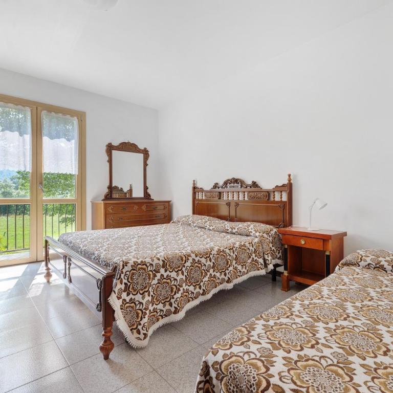 Casa Serena&Giacomo - Appartamento Deluxe con 2 Camere da Letto e Vista Giardino - 10